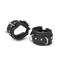 BDSM handcuffs made of black leather, padded