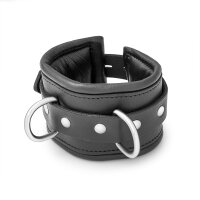 BDSM handcuffs made of black leather, padded